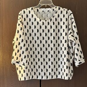Masai 3/4 sleeved ivory top with black and white circles. Sheer. Size Smaller